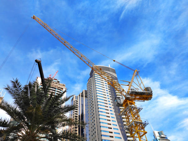 Dubai skyscrapers with construction cranes symbolize ongoing real estate opportunities in the city.