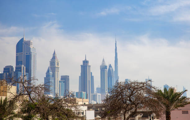 Dubai skyline with tall modern buildings, illustrating real estate market in "How to sell property in Dubai."